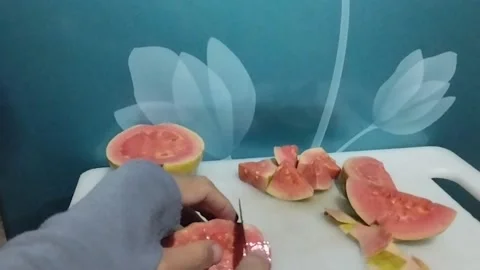 Red crystal guava fruit cut into small cubes Stock Footage 229253170