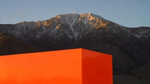 Red Cube Monolith Contemporary Art Snow Mountain Peak, Palm Springs Video stock 104679130