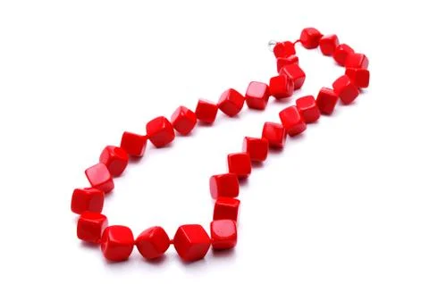 Red cubic beads on a white background with reflexion Stock Photos