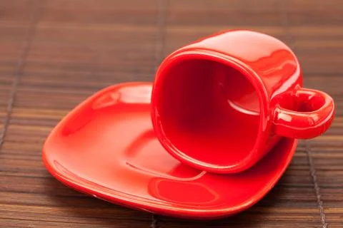 Red cup  on a bamboo mat Stock Photos