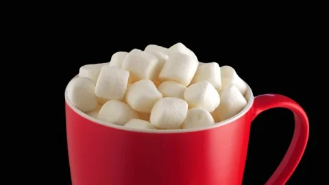 Red cup of cocoa with marshmallow, isolated on black background . Banner for Stock Footage 226386196