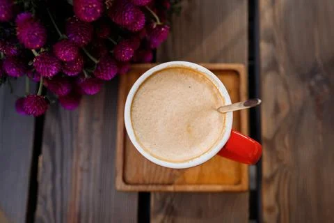 Red cup of coffee in a cafe on table Stock Photos