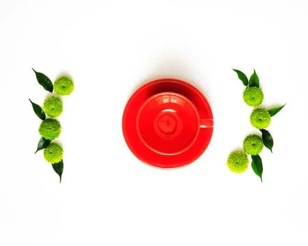 Red cup for coffee or tea with decoration. Stock Photos
