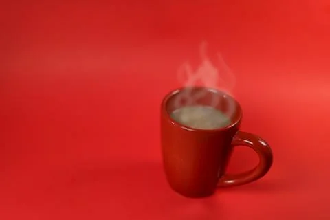 A red cup of coffee on the red background with space for product display mont Stock Photos