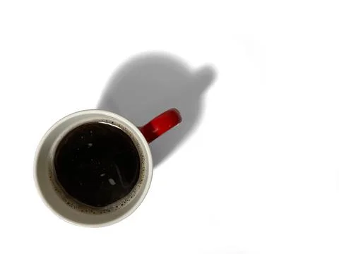 A red cup filled with fragrant, black coffee Stock Photos