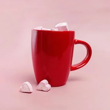 Red cup with Marshmallows in the shape of hearts Stock Photos