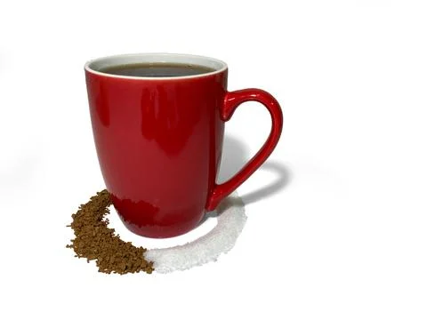 A red cup stands in a circle of coffee and sugar on a white background. Stock Photos