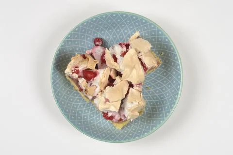 Red Currant Meringue Cake Slice on Patterned Plate Top View Stock Photos