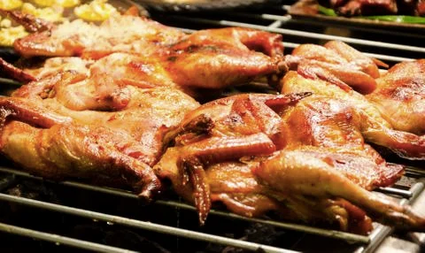 Red curry grilled chicken on the grill Stock Photos