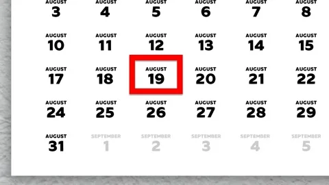 Red cursor highlighting August 19th on a 2026 wall calendar page Video stock 339425036