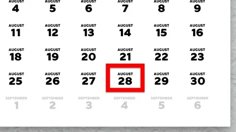 Red cursor highlighting August 28th on a 2026 wall calendar page Stock Footage 340558009