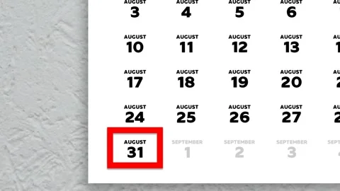 Red cursor highlighting August 31st on a 2026 wall calendar page Stock Footage 340560383