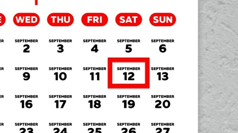Red cursor highlighting September 12th on a 2026 wall calendar page Stock Footage 346271745