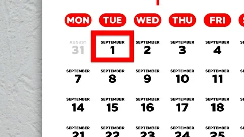 Red cursor highlighting September 1st on a 2026 wall calendar page Stock Footage 341118517