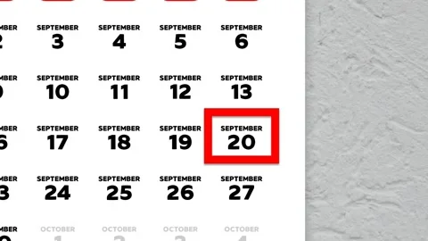 Red cursor highlighting September 20th on a 2026 wall calendar page Stock Footage 346272521
