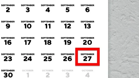 Red cursor highlighting September 27th on a 2026 wall calendar page Stock Footage 346273159