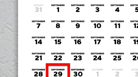 Red cursor highlighting September 29th on a 2026 wall calendar page Stock Footage 346273313