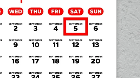 Red cursor highlighting September 5th on a 2026 wall calendar page Stock Footage 341514150