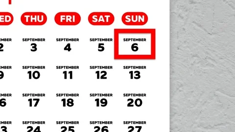 Red cursor highlighting September 6th on a 2026 wall calendar page Stock Footage 341515088