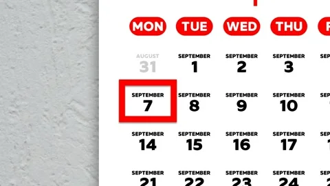 Red cursor highlighting September 7th on a 2026 wall calendar page Stock Footage 341809238