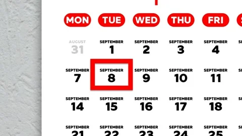 Red cursor highlighting September 8th on a 2026 wall calendar page Stock Footage 341809491