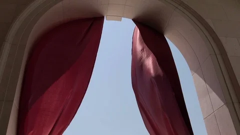 Red curtain in the arch develops in the wind. slow motion Stock Footage 96128797