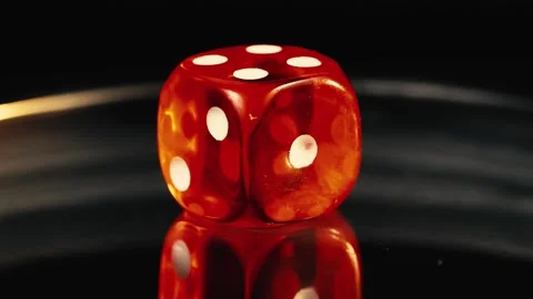Red D6 dice rotating board game macro with reflections 4K Stock Footage 252029460