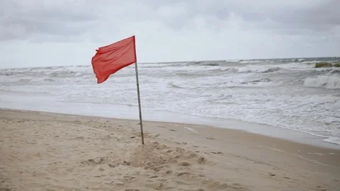 Red Danger Flag at the Beach before a Storm or Hurricane Stock Footage 78373737