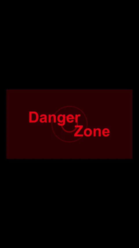 Red danger zone text with circle and dashed line on dark background. Alert .. Stock Footage 345964617