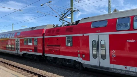 Red DB passengers train arrives at Frankfurt Niederrad train station. Frankfurt Stock Footage 195677712