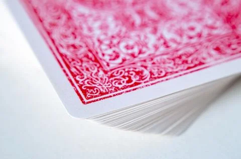 Red deck of playing cards over white background . Fotos de archivo