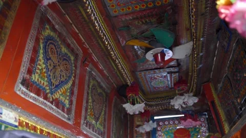 Red decorations inside of driver cabin of a very old Pakistani Jingle Truck Stock Footage 132927348