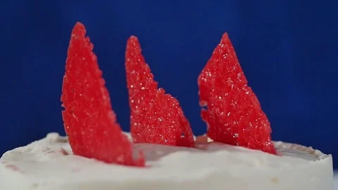 Red decorative element on the cake. Marmalade on the cake. Slice of strawberry Stock Footage