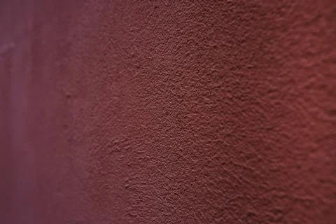 Red decorative plaster on the wall Stock Photos