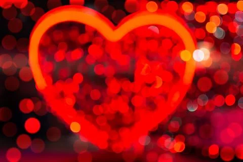 Red defocus light in the shape of a heart Stock Photos