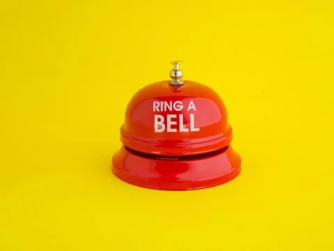 The red desktop bell has the message "ring a bell" placed on a bright yellow  Stock Photos