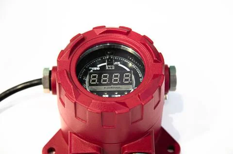 A red device with a digital display. This device is a fire infrared monitor.. Stock Photos