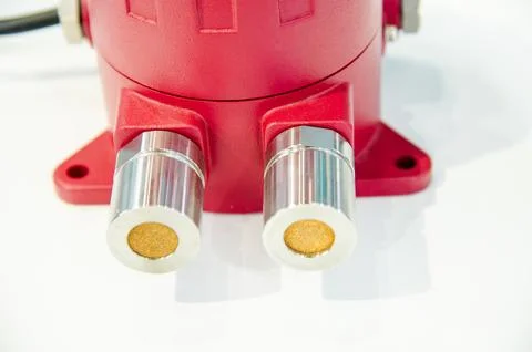 A red device with a digital display. This device is a fire infrared monitor.. Stock Photos