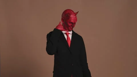 Red devil businessman making a call me gesture Stock Footage 296240377