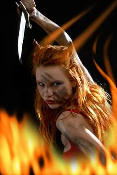 Red devil girl with a knife in fire 스톡 일러스트