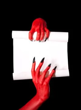 Red devil hands holding blank paper scroll Stock Photos