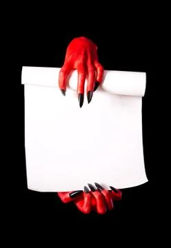 Red devil hands holding paper scroll Stock Photos