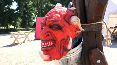 The red devil's mask with a rope tied to a pole Stock Footage 99520518