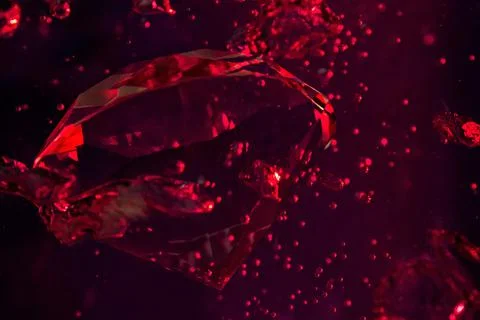 Red diamond in water with bubbles. Stock Photos
