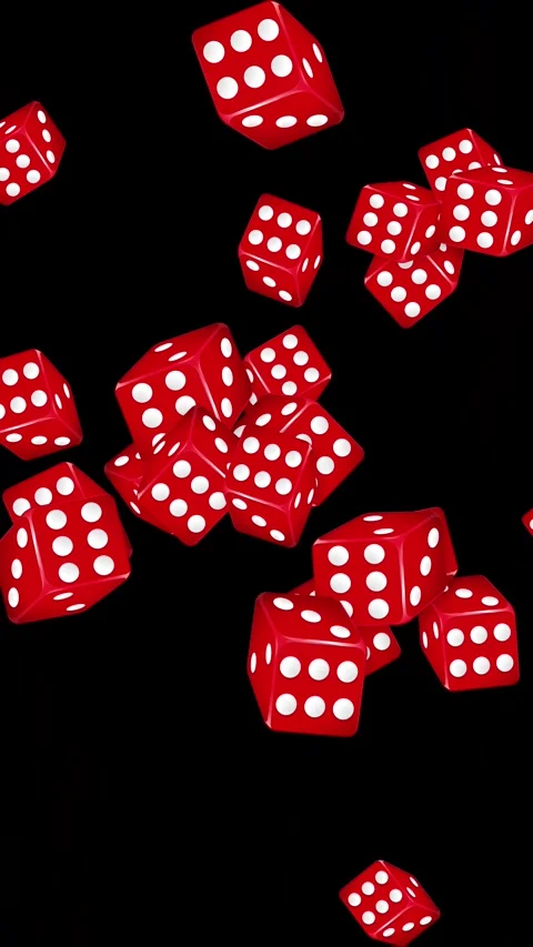 Red Dice Falling and Bursting Against a Solid Black Background Stock Footage 345704803