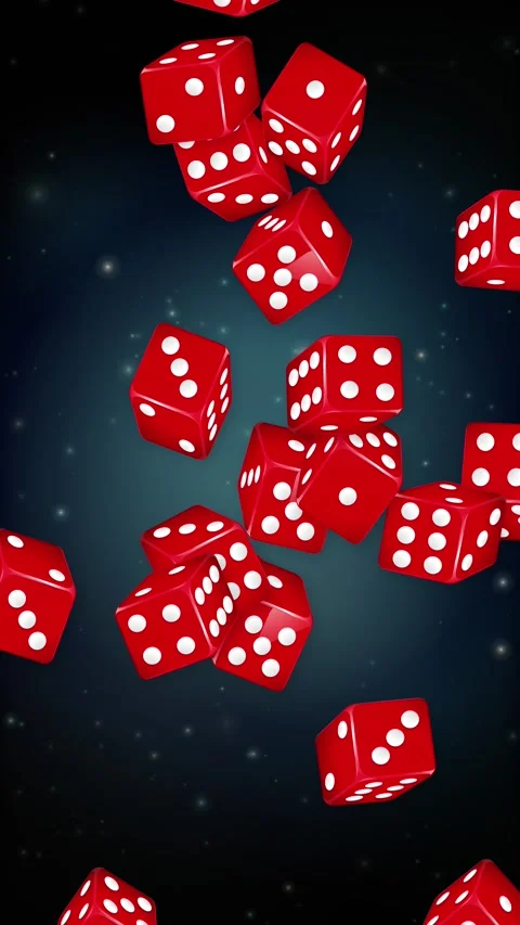 Red Dice Falling Downwards Against a Dark Blue Background Stock Footage 341067874