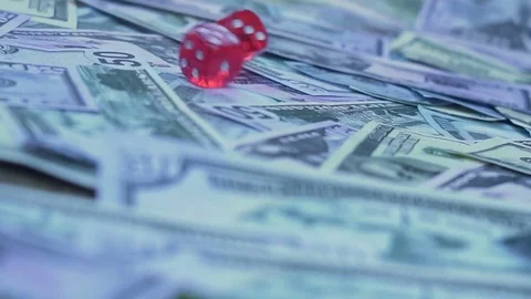 Red dice falling on money hd Stock Footage 79866054