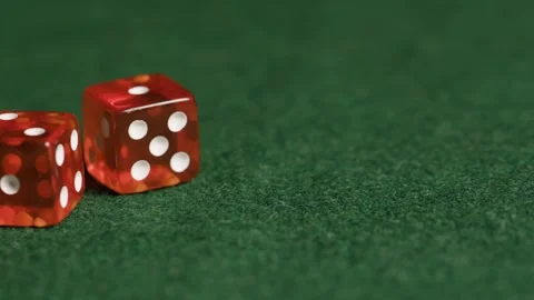 Red Dice on green background table 1 Stock Footage 260518225