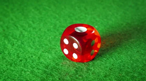 Red dice on the green cloth background. Rotation. Number. Stock Footage 58646176