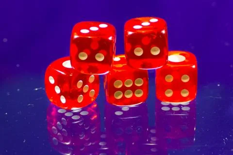 Red dice near a camera Stock Photos